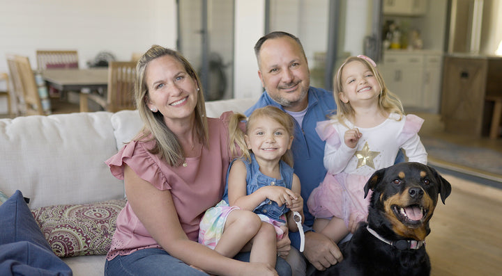 family sitting on couch from amish furniture store